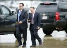  ?? ALEX BRANDON — THE ASSOCIATED PRESS ?? White House Director of Social Media Dan Scavino, left, walks with former White House Chief of Staff Reince Priebus steps off Air Force One as they arrive Friday at Andrews Air Force Base, Md.