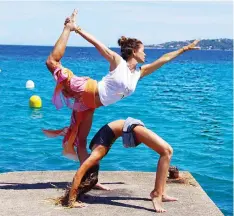  ?? BROOKE BURKE CHARVET/AP ?? Charvet doing yoga with her daughter Rain in Malibu, Calif.