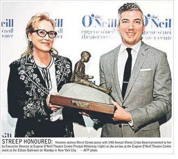  ??  ?? Honoree actress Meryl Streep poses with 14th Annual Monte Cristo Award presented to her by Executive Director at Eugene O’Neill Theatre Centre Preston Whiteway (right) as she arrives at the Eugene O’Neill Theatre Centre event at the Edison Ballroom on...