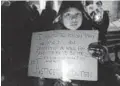  ?? METROLAND MELINDA CHEEVERS ?? Alexis Isaacs holds a sign during a vigil for Colten Boushie in St. Catharines.