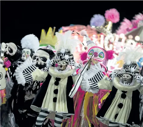  ?? MAURO PIMENTEL/ GETTY IMAGES ?? Revellers of the Mangueira samba school perform during Carnival at the Sambadrome in Rio de Janeiro, Brazil. Drag queen Pabllo Vittar will headline the parade of one of Rio de Janeiro’s most storied samba schools, Beija- Flor de Nilopolis samba school.