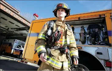  ?? NWA Democrat-Gazette/DAVID GOTTSCHALK ?? Dylan Poe, a Springdale firefighte­r, displays an air tank pack from Engine 4 at Fire Station 4 at 3420 Elm Springs Road. The city proposes three new fire stations in it’s upcoming bond issue. One will be in the far northwest corner of Springdale. The...