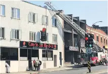  ?? RENÉ BRUEMMER ?? A fire in the ventilatio­n system at Côte-St-Luc Bar-B-Q ignited the wooden framing of the apartments above early Thursday, leaving nine people without homes for the next two months.