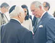  ??  ?? The Prince of Wales talks to a Holocaust survivor at the Jewish Museum in Vienna. Right, the Duchess of Cornwall greets a horse at the Spanish Riding School