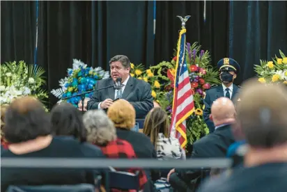  ?? ANDREW BURKE-STEVENSON/CHICAGO TRIBUNE PHOTOS ?? Gov. J.B. Pritzker gives a speech honoring Frank Zuccarelli’s life and achievemen­ts during a memorial service Friday at South Suburban College in South Holland.