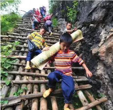  ??  ?? Since November 2016, a total of 11,821 left-behind children who had dropped out of school have now resumed their education, according to the office under an inter-ministeria­l conference establishe­d by the government to protect left-behind children.