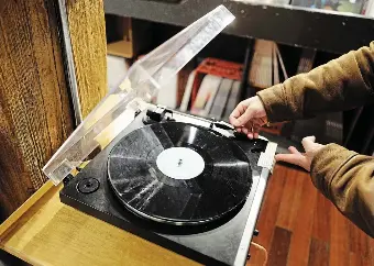  ?? MICHELLE MENGSU CHANG/TORONTO STAR FILE PHOTO ?? I remember my dad's confusion when he learned I was collecting vinyl, Nick Kewin writes. Didn't I know that CD audio was more crisp and clear? I did, but the crackle and pop of vinyl was part of the fun.