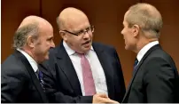  ?? — Reuters ?? Spain’s Finance Minister Luis de Guindos and German acting Minister of Finance Peter Altmaier chat with Estonia’s Finance Minister Toomas Toniste at the start of an eurozone finance ministers meeting in Brussels.