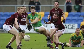  ??  ?? Laragh’s Steve Olohan has his legs taken away by the Kilcavan defence.