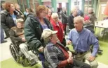  ?? PHILCARLSO­N/ THE QUINCYHERA­LD- WHIG VIAAP ?? Gov. Bruce Rauner talks to people at the Illinois Veterans Home after staying at the home in Quincy in January.