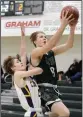  ?? NEWS PHOTO RYAN MCCRACKEN ?? Hat High Mohawks guard Austin Walton drives to the basket for a layup during a game against Central Memorial in the Medicine Hat High School Green and White tournament Saturday.