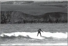  ?? The New York Times/THERESE AHERNE ?? The waves off Ireland’s Dingle Peninsula in County Kerry provide good surfing opportunit­ies, depending on the weather.