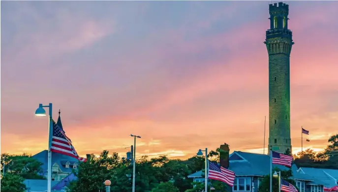  ?? PHOTOS COURTESY PROVINCETO­WN TOURISM ?? PASTEL SKIES: Provinceto­wn’s Pilgrim Monument stands out against the colors of sunset.