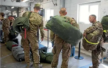  ?? GETTY IMAGES ?? US troops queue at the airport terminal to catch a flight home at Kandahar airfield on November 13, 2014. US President Joe Biden will lay out plans today to withdraw all US forces from Afghanista­n by September 11, the 20th anniversar­y of the al-Qaeda attacks on the United States that were planned from Afghan soil.