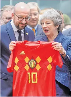  ??  ?? SHIRTY: Belgium’s Charles Michel’s gift for Mrs May