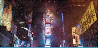  ??  ?? The ball drops to enter in the new year during New Year’s Eve celebratio­ns in Times Square in New York.