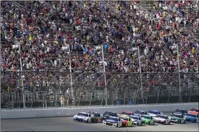  ?? CARLOS OSORIO — THE ASSOCIATED PRESS ?? Kyle Larson, front left, leads the field to start the NASCAR Cup Series race at Michigan Internatio­nal Speedway on Aug. 22 in Brooklyn, Mich.