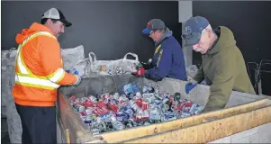  ?? NIKKI SULLIVAN/CAPE BRETON POST ?? From left, Bill Paul, Brent Hawryluk and Jim Bonnar sort through bottles at Triple B Recycling.