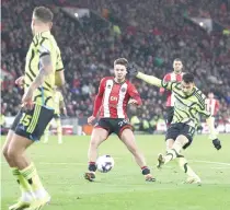  ?? PHOTO BY DARREN STAPLES/AFP ?? ON A ROLL
Arsenal’s Brazilian midfielder Gabriel Martinelli (right) scores the team’s third goal during the English Premier League football match between Sheffield United and Arsenal at Bramall Lane in Sheffield, northern England, on Monday, March 4, 2024.