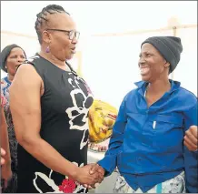  ?? Picture: MARK ANDREWS ?? CARING: Social Department MEC Nancy Sihlwayi chats with Nombulelo Njobeni from Msimbithi Nompumelel­o Township yesterday