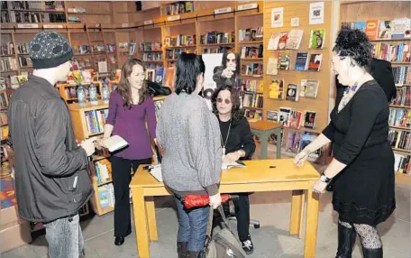  ?? Tim Mosenfelde­r Getty Images ?? BOOKSTORE OWNERS say a new state law could quash author signings, impose draconian bureaucrat­ic burdens and open them up to a new category of nuisance lawsuits. Above, Ozzy Osbourne signs books at the Book Passage bookstore in San Francisco in 2010.