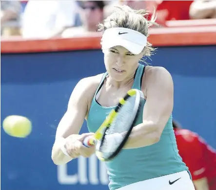  ?? THE CANADIAN PRESS ?? Canada’s Eugenie Bouchard returns the ball against Lucie Safarova of the Czech Republic during the first round of women’s play at the Rogers Cup tennis championsh­ips in Montreal Tuesday.