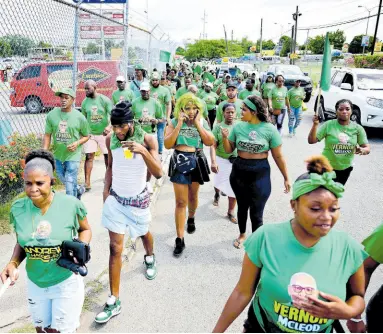  ?? GLADSTONE TAYLOR/MULTIMEDIA PHOTO EDITOR ?? Jamaica Labour Party supporters on their way to the St Andrew North Western nomination centre on Thursday, February 8.