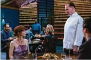  ?? ERIC ?? Anya Taylor-joy and Ralph Fiennes star in “The Menu,” a satire of the over-the-top world of high-end dining.