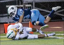  ??  ?? Saugus’ Mikel Rabadi, 23, tackles a Canyon player during Thursday night’s game.