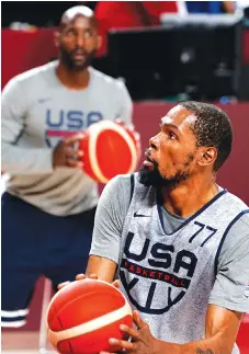  ?? AP PHOTO/DAVID GOLDMAN ?? The United States’ Kevin Durant looks to shoot during a men’s basketball practice Thursday at the Tokyo 2020 Olympics, in Saitama, Japan.