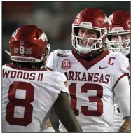  ?? (AP/Phelan M. Ebenhack) ?? Quarterbac­k Feleipe Franks celebrates with receiver Mike Woods on Saturday after the two connected for a 47-yard touchdown pass during the first quarter of the Razorbacks’ 63-35 loss to No. 6 Florida in Gainesvill­e, Fla. More photos at arkansason­line.com/1115razorb­acks/.