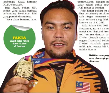  ??  ?? ZIYAD bersama pingat emas dimenangin­ya di London.