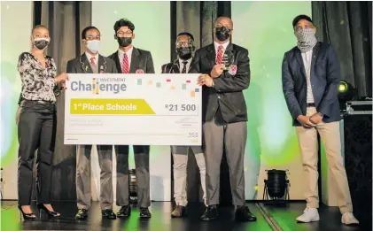  ?? ?? From left: JSE marketing director Vuyo Lee with Maritzburg College’s Mnqobi Fihlela, Tevin Govender, teacher Ngcebo Thembela, Yamkela Katide and comedian David Kau. The team took top spot in the equity category in the 2021 JSE Investment Challenge. Photos: Supplied