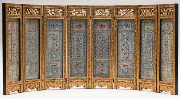  ??  ?? This eight- panel screen from early 20th century Penang, measuring 42cm x 88cm, is modelled on Chinese table screens and is a rare example of Nyonya needlework. — Peranakan Museum singapore