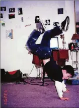 ?? CONTRIBUTE­D ?? Oscar demonstrat­es his handstand skills in 2004.