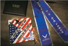  ?? NATHAN BURTON/Taos News ?? Mateo Espinoza’s high school diploma, graduation cap and U.S. Air Force sash.