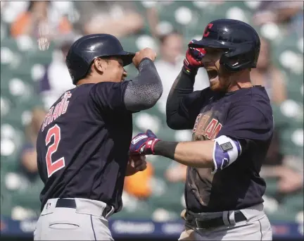  ?? CARLOS OSORIO — THE ASSOCIATED PRESS ?? Jordan Luplow, right, is greeted by Yu Chang after Luplow’s two-run home run during the seventh inning April 4in Detroit.