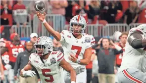  ?? ADAM CAIRNS/COLUMBUS DISPATCH ?? Ohio State quarterbac­k C.J. Stroud throws a pass in the Peach Bowl at Mercedes-benz Stadium. Ohio State lost 42-41.