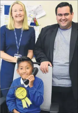  ?? Picture: Paul Amos FM4804692 ?? Sesehang takes the important calls in the head teachers as head Catherine Hylands and chair of governors Cllr Brendan Chilton await their orders