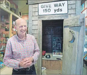  ?? THE CANADIAN PRESS ?? Sherman Hines stands inside the Outhouse Museum in Liverpool, N.S., on Tuesday. The main display is located inside the Rossignol Cultural Centre which houses a wildlife exhibit, an art gallery, a hunting and fishing museum featuring a replica of a...