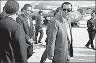  ?? AP/HENG SINITH ?? Cambodian Prime Minister Hun Sen (center) arrives at the airport Saturday in Phnom Penh after a quick trip to Laos for talks with Laotian Prime Minister Thongloun Sisoulith.