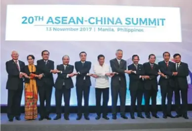  ??  ?? Chinese Premier Li Keqiang, Philippine President Rodrigo Duterte and leaders of nine other ASEAN countries stand for a photo at the 20th ASEAN-CHINA Summit in Manila, the Philippine­s, on November 13, 2017.