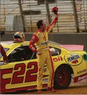  ?? WADE PAYNE/AP ?? Joey Logano celebrates with the crowd after Monday’s win. “There’s nothing like winning at Bristol, but putting it on dirt and being the first to do it is very special,” he said.