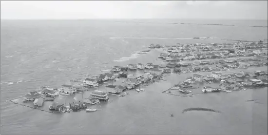  ?? U.S. Coast Guard/reuters ?? Homes lie flooded after Hurricane Sandy made landfall in New Jersey on Tuesday. Obama declared that “major disasters” existed in both New York and New Jersey.