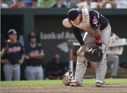  ?? GAIL BURTON — THE ASSOCIATED PRESS ?? Indians catcher Roberto Perez reacts after hitting the Orioles’ Pedro Alvarez when throwing to first in the ninth inning July 25 in Baltimore.