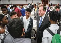  ??  ?? Acosta talks with students from Lake Worth High School at his Forum Club appearance. Acosta said the country has about 6 million unfilled jobs because of the lack of trained people to fill them.