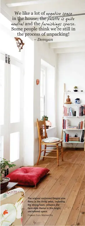  ??  ?? The original unstained Oregon pine floors in the living areas, including the dining room, enhance the farm-style theme in this bright, uncluttere­d space. Flowers from Woolworths