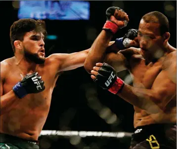  ?? ASSOCIATED PRESS ?? RONALDO SOUZA, RIGHT, FROM BRAZIL, FIGHTS KELVIN GASTELUM, martial arts bout in Rio de Janeiro, Brazil, Saturday. from the United States, during their UFC middleweig­ht mixed