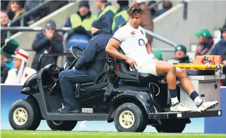  ?? PICTURE: Clive Rose/getty Images ?? Anthony Watson is wheeled off the Twickenham turf in March