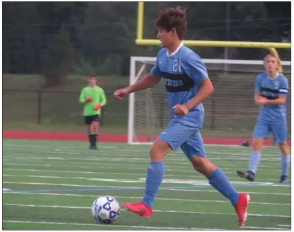  ?? MIKE CABREY — MEDIANEWS GROUP ?? North Penn’s Jim Perrin (21) dribbles the ball during the Knights’ game against Lansdale Catholic Wednesday.